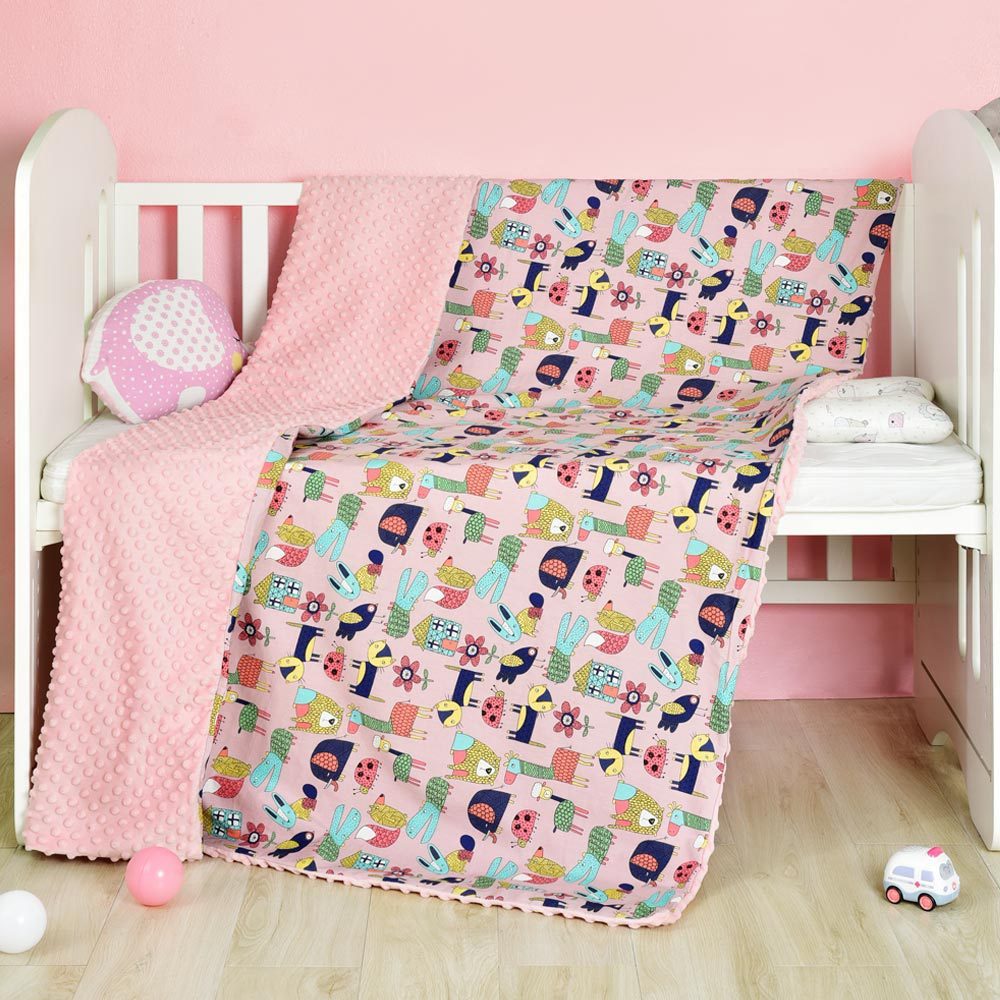 Zweiseitige Babydecke aus Baumwolle – kindgerechte Motive & unifarbene Rückseite
